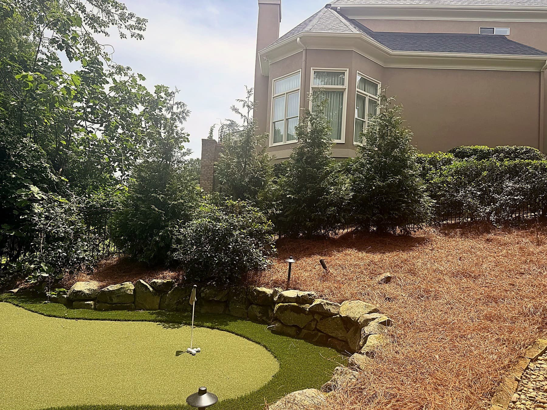 Finished Johns Creek, GA landscape with newly planted Green Giant Arborvitae privacy trees and fresh pine-straw beds